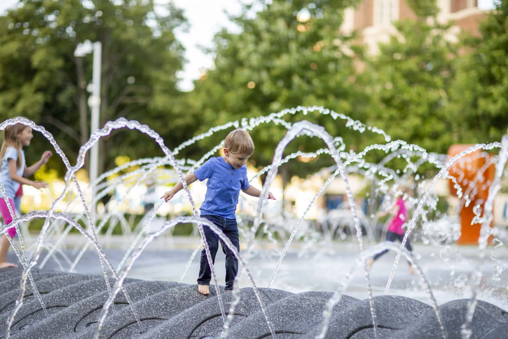 Day In the Life Navy Pier Kid In Fountain Action Photo
